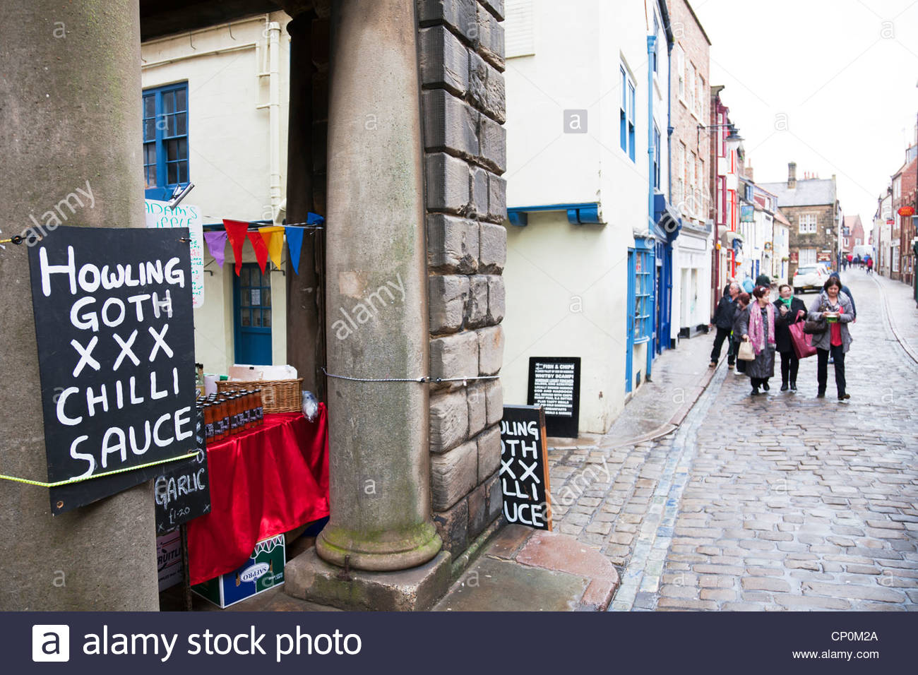 whitby-town-north-yorkshire-uk-england-market-stall-selling-howling-CP0M2A